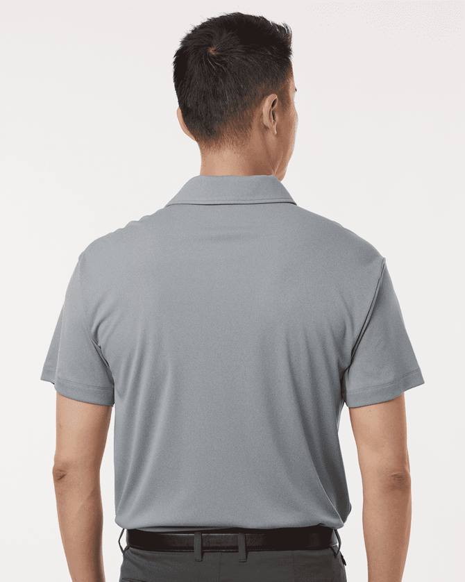 A grey men's polo shirt with a collar and short sleeves, featuring a logo on the back.