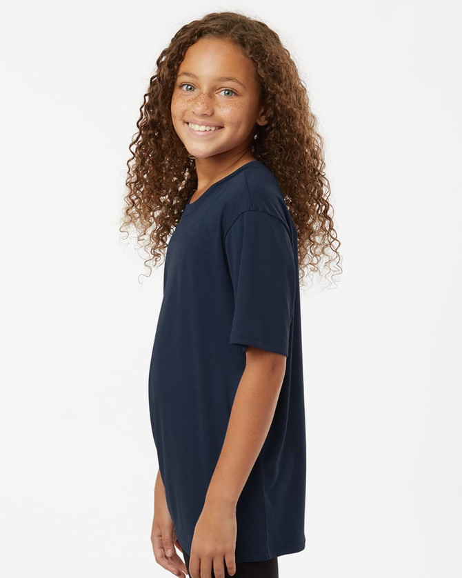 A navy blue youth T-shirt with short sleeves, featuring a logo on the back. The model smiles with curly hair.