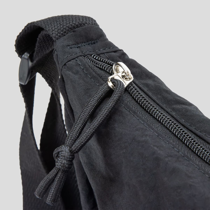 A black bag featuring a zip closure and adjustable strap, with a woven texture. It includes a logo on the side.
