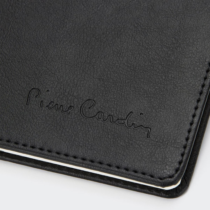 A black diary with a textured cover and embossed branding, featuring white stitching along the edges.