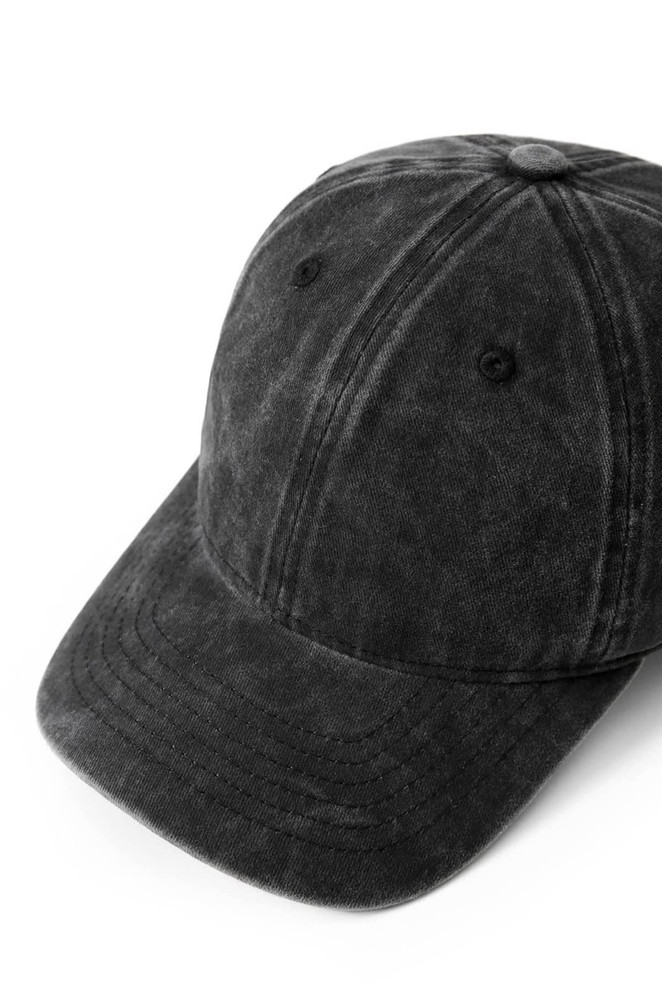 A black unstructured cap made from 280GSM cotton drill, featuring an adjustable strap and a logo.
