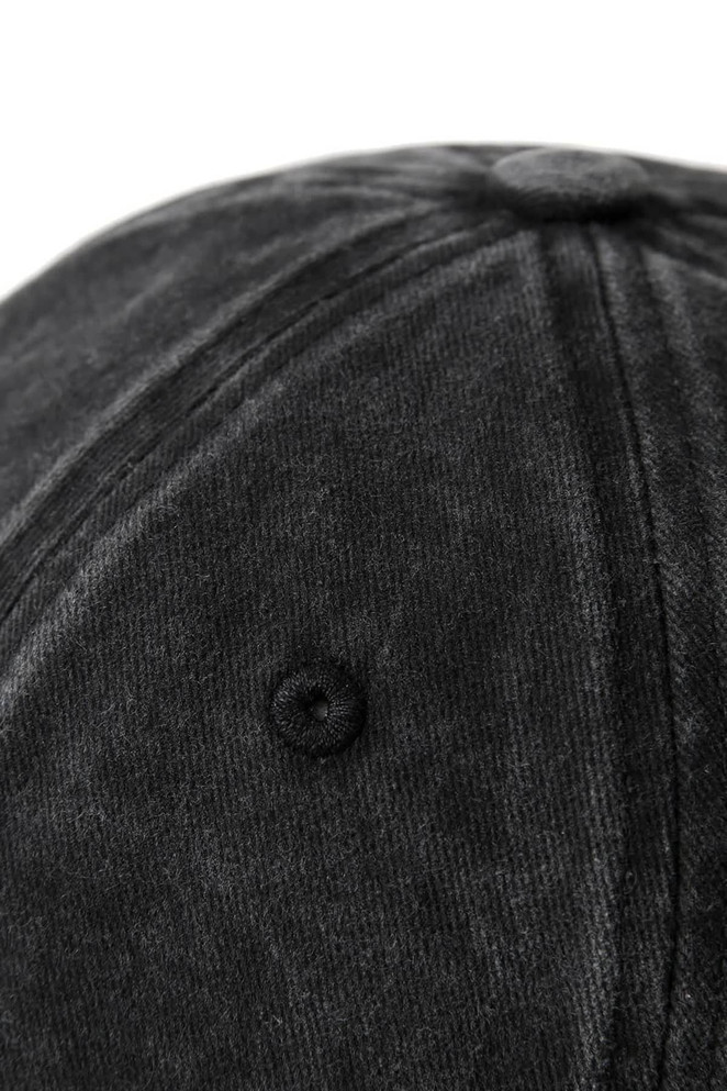 A dark grey cotton cap with a textured surface and a logo on the front. The underside of the cap is visible.
