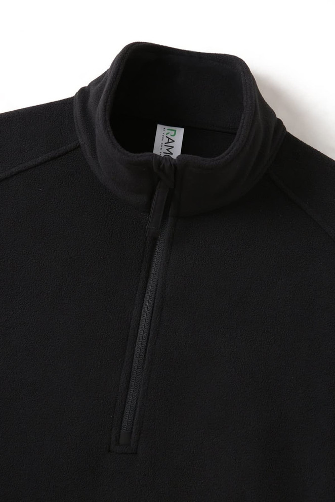 A black polar fleece half zip top featuring a high collar and a zippered front, with a logo.