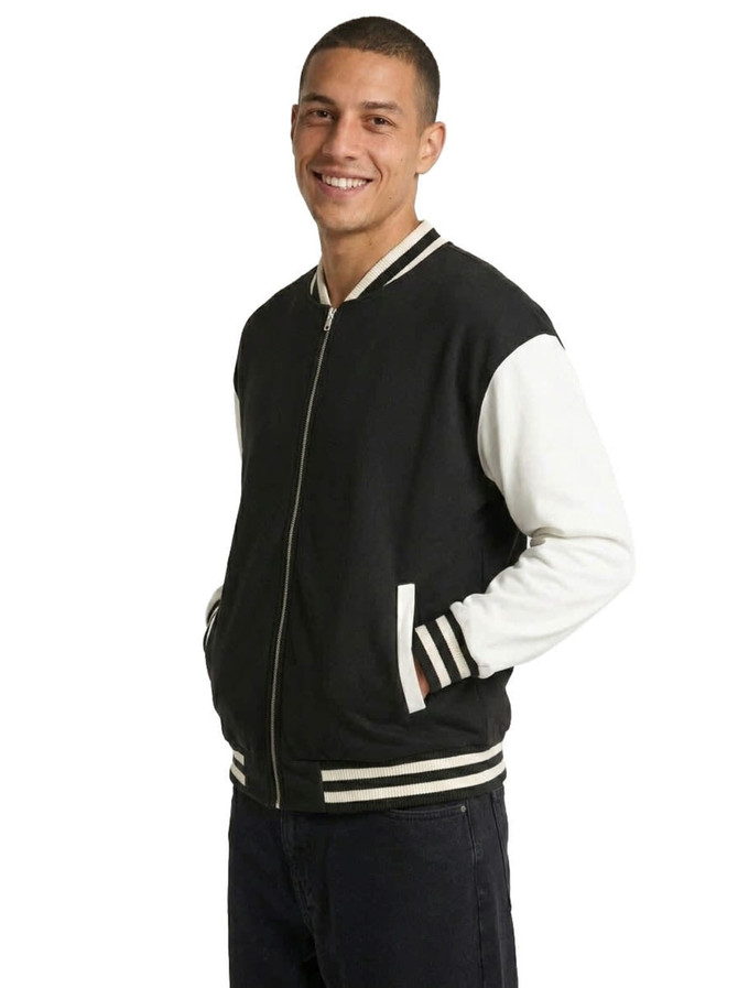 A black and white men's/unisex wool blend varsity jacket with a zip front and ribbed cuffs.