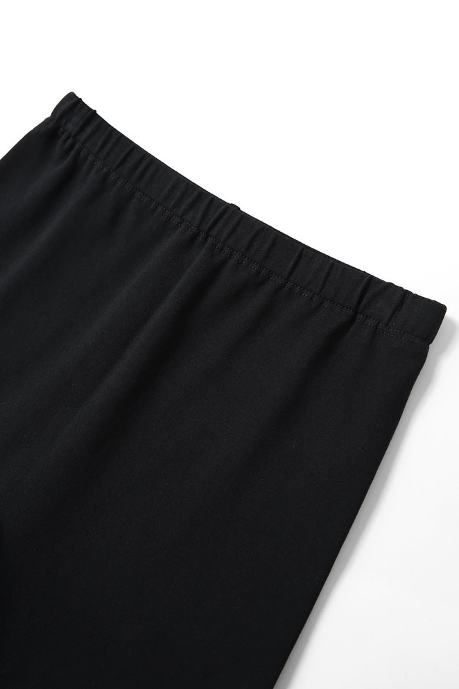 Black girl's cotton spandex shorts with an elasticised waistband, featuring a simple design and no visible logos.