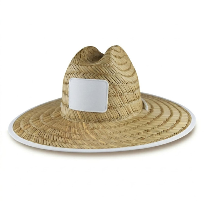A straw beach hat with a wide brim, featuring a white logo area on the front. Natural straw colour with a white trim.