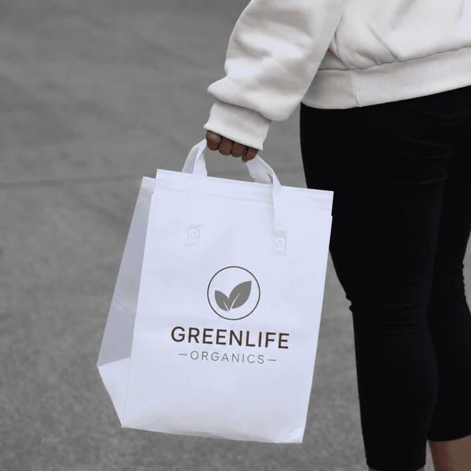 A white insulated reusable bag with two handles, featuring a logo on the front.