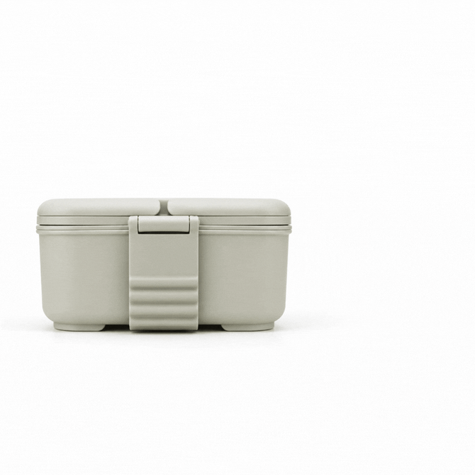 A grey Stack & Go Lunchbox with a secure clasp and two compartments. It features a simple design and a branding logo.