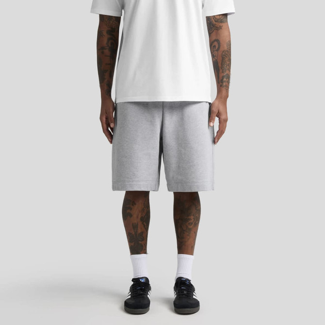 Grey shorts with an elasticated waist, paired with a white t-shirt, worn by a person with visible tattoos.