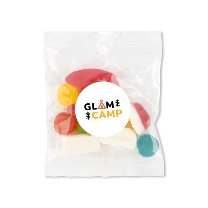 A clear plastic bag containing colourful gummy candies in various shapes, with a circular logo on the front.