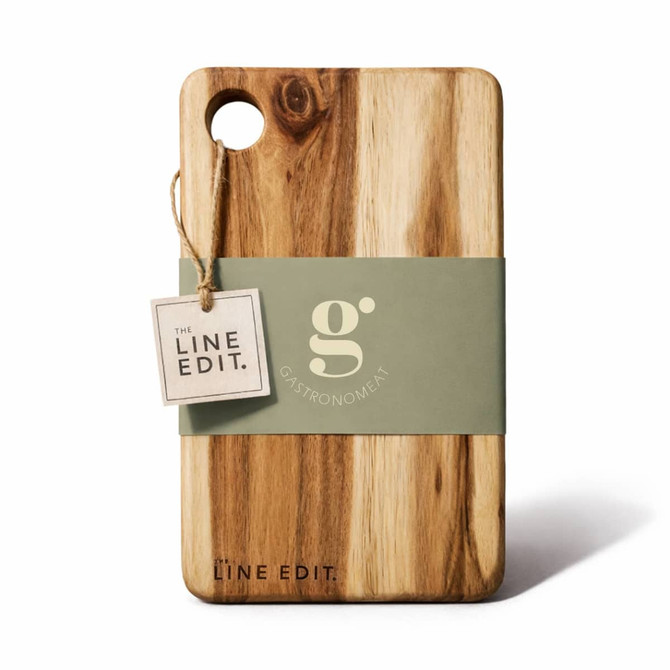 Acacia serving board with a natural wood finish and a hole for easy handling, featuring a logo and a tag.
