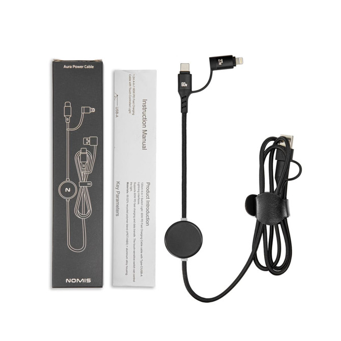 A power cable in black with an instruction manual and packaging, featuring a circular cable holder.