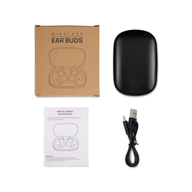 A set of black wireless ear buds inside a charging case, with a USB cable and instruction manual beside them.
