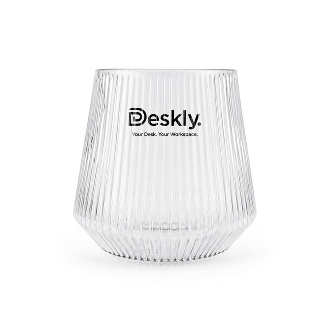 A clear glass tumbler with ribbed texture and a logo at the front.