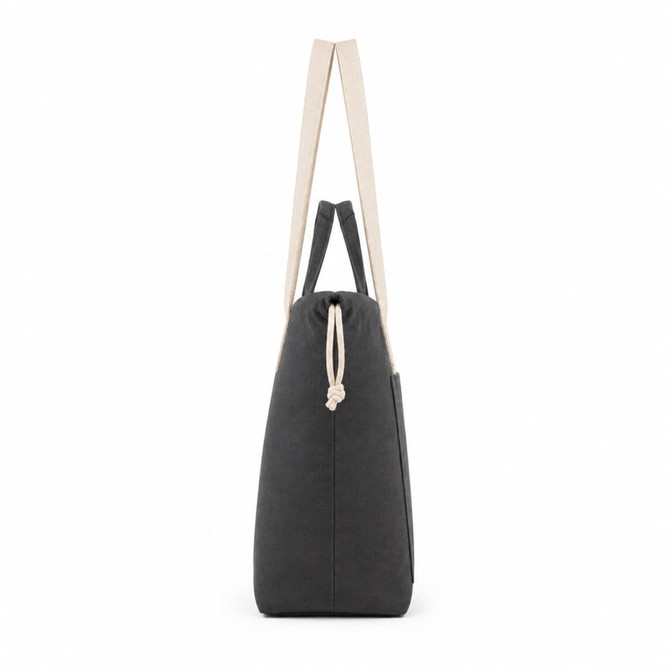 A grey tote bag with cream straps and a drawstring closure, featuring a side pocket.