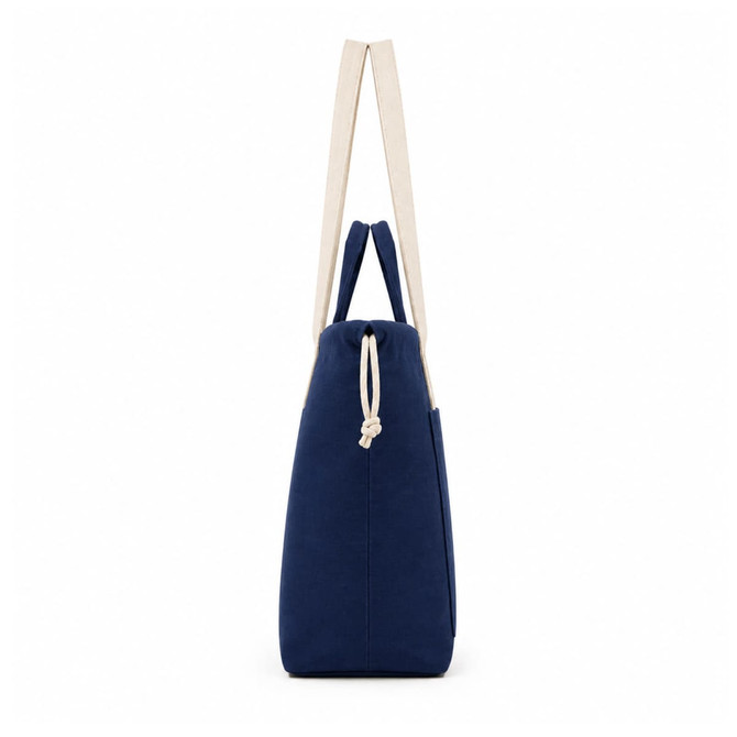 A navy tote bag with cream handles and a drawstring closure, featuring a subtle logo.