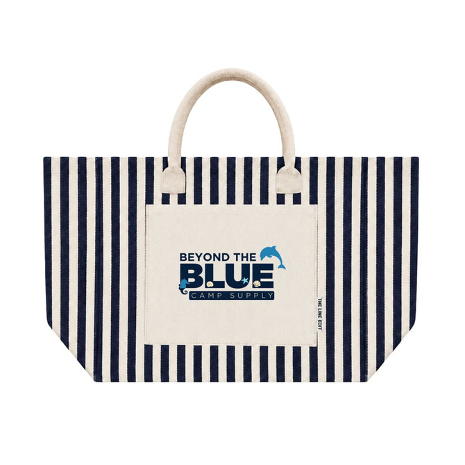 A striped tote bag with a cream base and navy blue stripes. It features a front pocket and a logo.