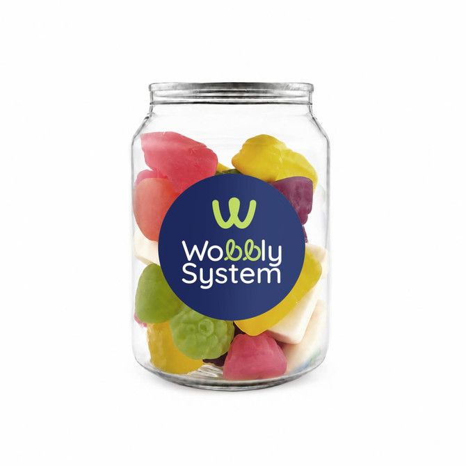 A clear jar filled with colourful gummy sweets in various shapes, including yellow, green, pink, purple, and white.
