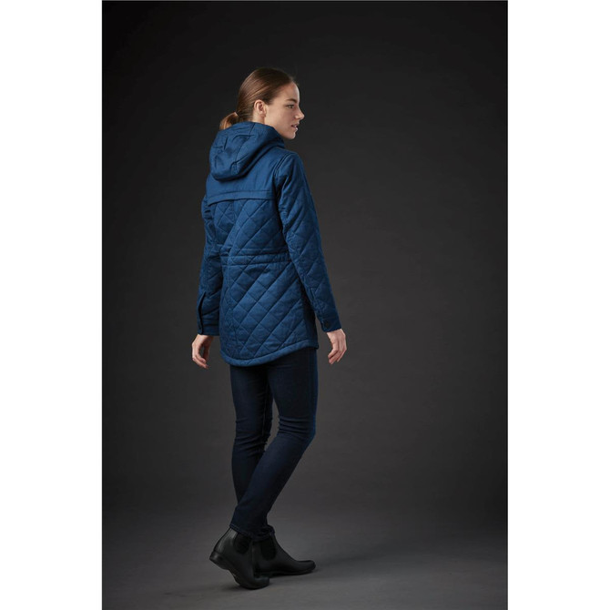 A woman's navy blue quilted puffer jacket with a hood, featuring a brand logo, displayed from the back.