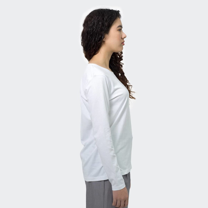 A white long sleeve crew shirt displayed on a person from the side, featuring a simple design and a branding logo.