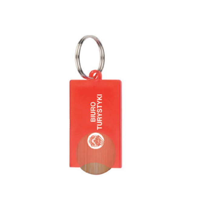 A red key tag with a circular cutout and a metal keyring, featuring a logo on one side.