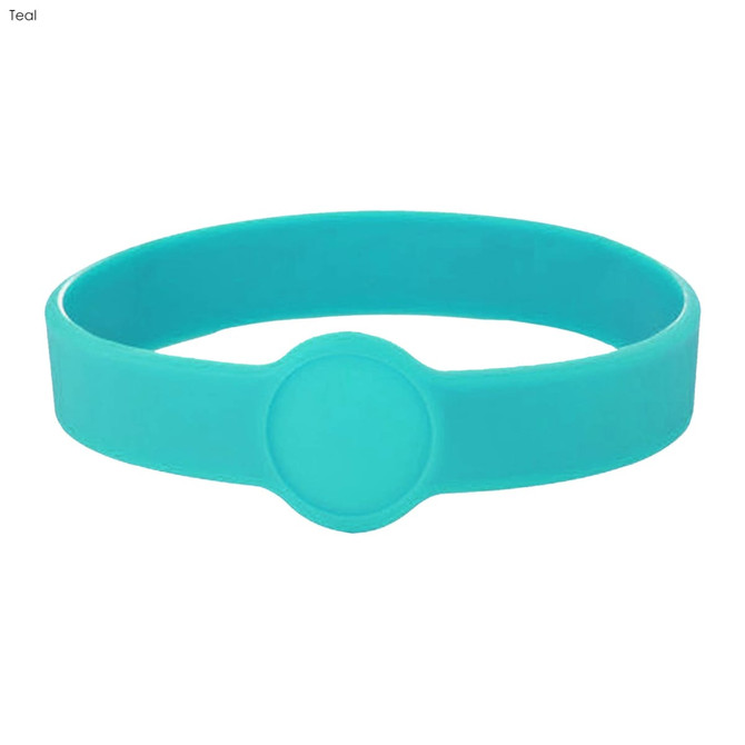 A teal silicone wristband with a circular centre design. Includes a logo.