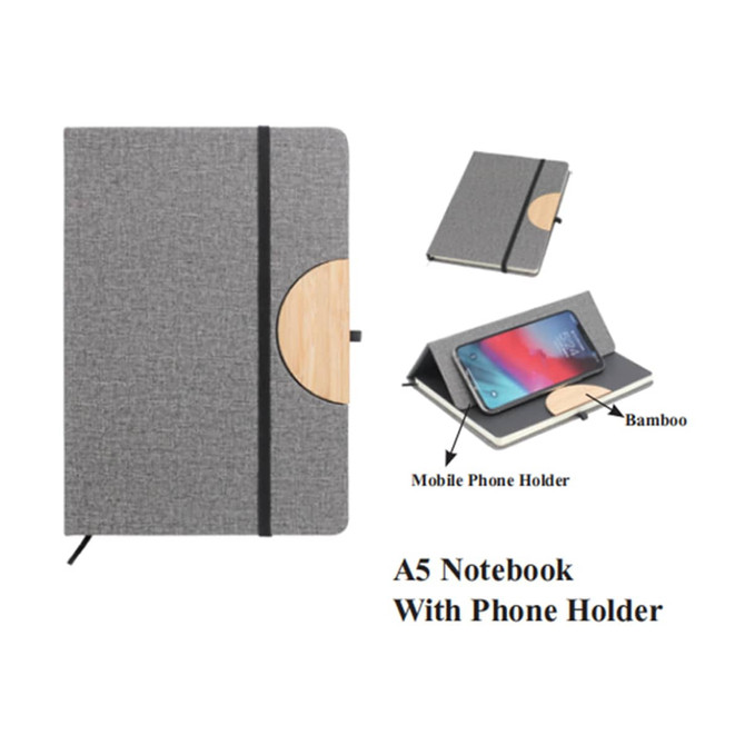 A5 notebook in grey fabric with a bamboo phone holder. Features an elastic band for closure.