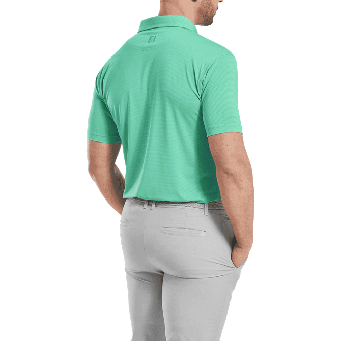A men's short-sleeve polo shirt in turquoise with a collar, featuring a logo on the back and grey trousers.
