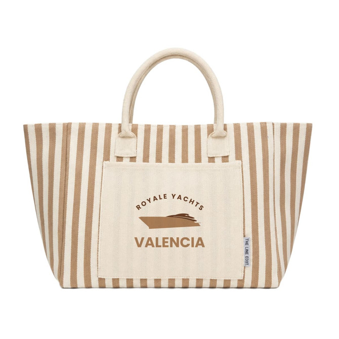 A striped tote bag in beige and cream with a logo and a large front pocket.