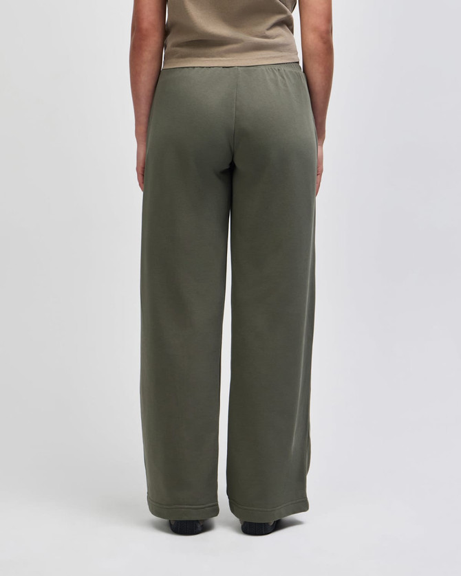 Wide leg pants in olive green, featuring a comfortable elastic waistband. The design is simple and relaxed.