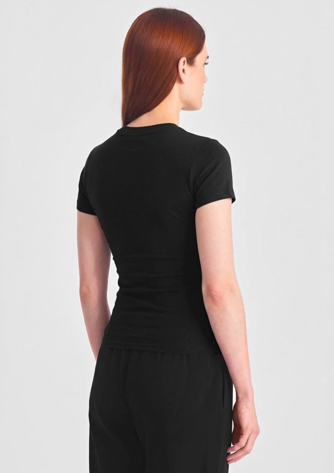 A black women's baby tee displayed from the back, featuring a fitted style and short sleeves.