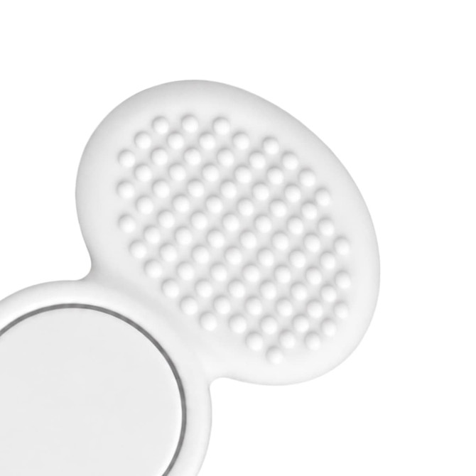 A tactile fidget spinner in white, featuring a smooth side and a textured side with small raised bumps.