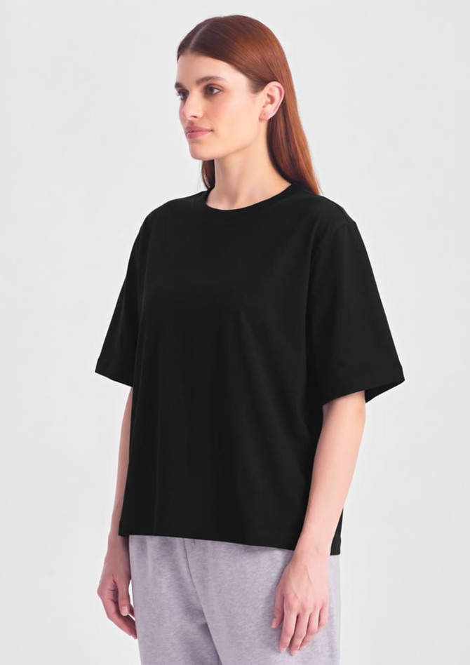 A black box tee with short sleeves, displayed on a model against a plain background.