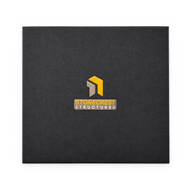A black textured folder featuring a logo in the centre. The logo includes yellow and grey elements.