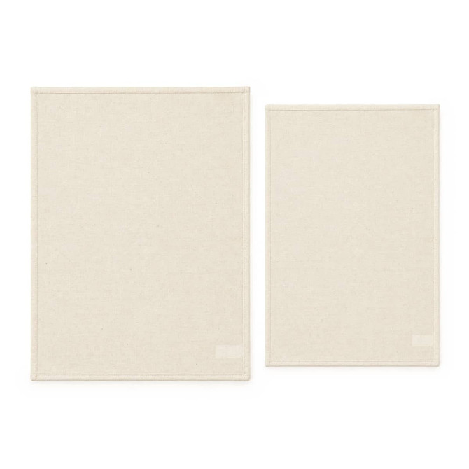 Two cotton tea towels in a light beige colour, one larger and one smaller, both featuring a brand logo.