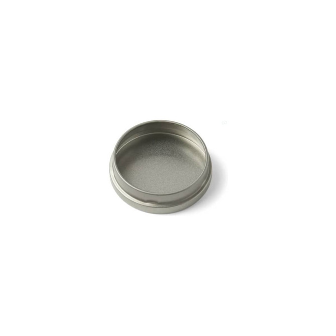 A silver mini tin candle with a smooth, unfilled interior and a rounded edge. It features a logo on the exterior.