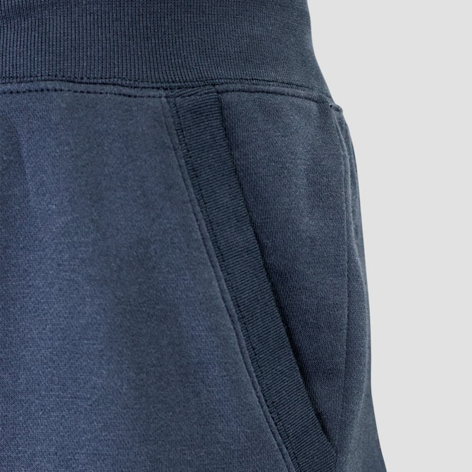 Dark navy unisex sweatpants featuring a side pocket and elastic waistband, with a subtle logo detail.