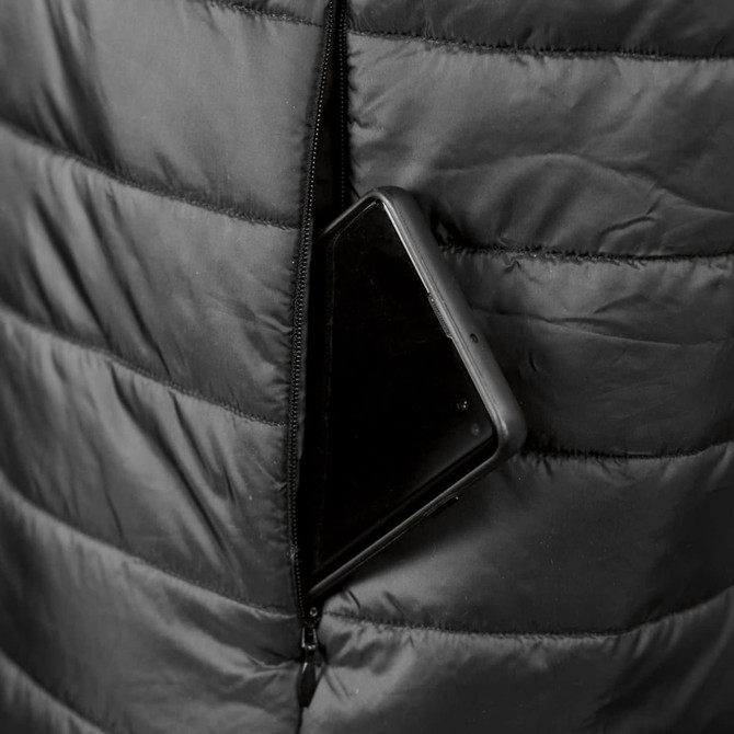 A black puffer vest featuring a zippered pocket with a smartphone partially visible inside.