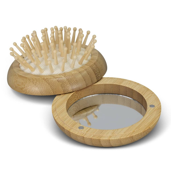 A bamboo brush with wooden bristles and a bamboo mirror, both featuring a natural finish.