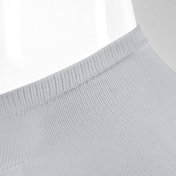 A pair of grey ankle socks displayed on a mannequin. The socks feature a ribbed design and a branding logo.