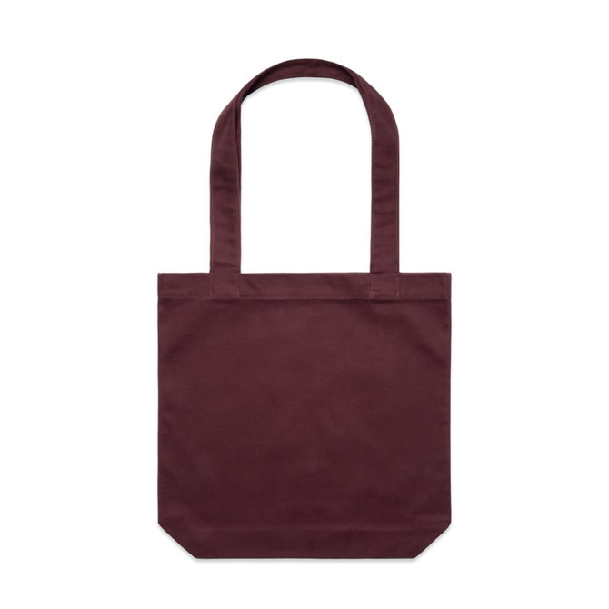 A maroon tote bag with two long handles and a plain design, featuring a logo on one side.