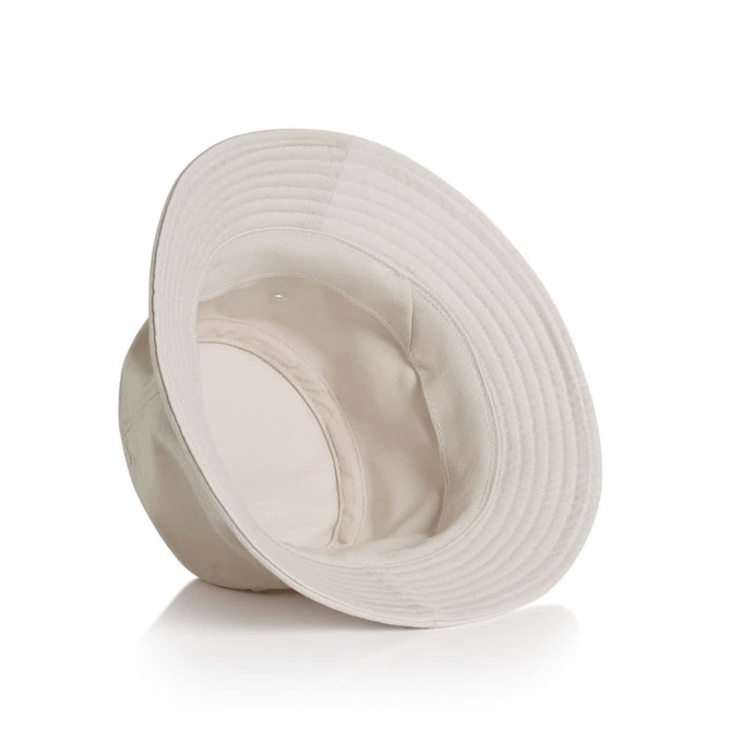 A cream bucket hat with a wide brim, featuring an inner lining and a subtle logo.