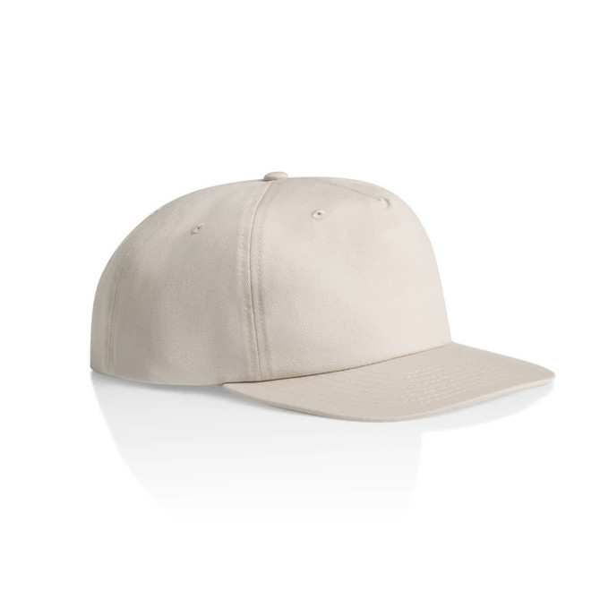 A light beige cotton cap with a flat brim, featuring a logo on the front.
