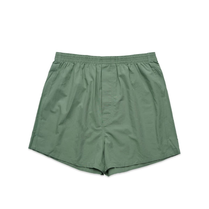 Green boxer shorts with an elastic waistband, featuring a simple design and no patterns.