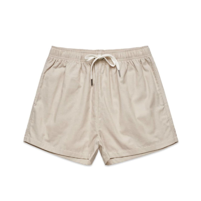 Beige dress shorts with an elastic waistband and drawstring, featuring a simple design and no visible branding.