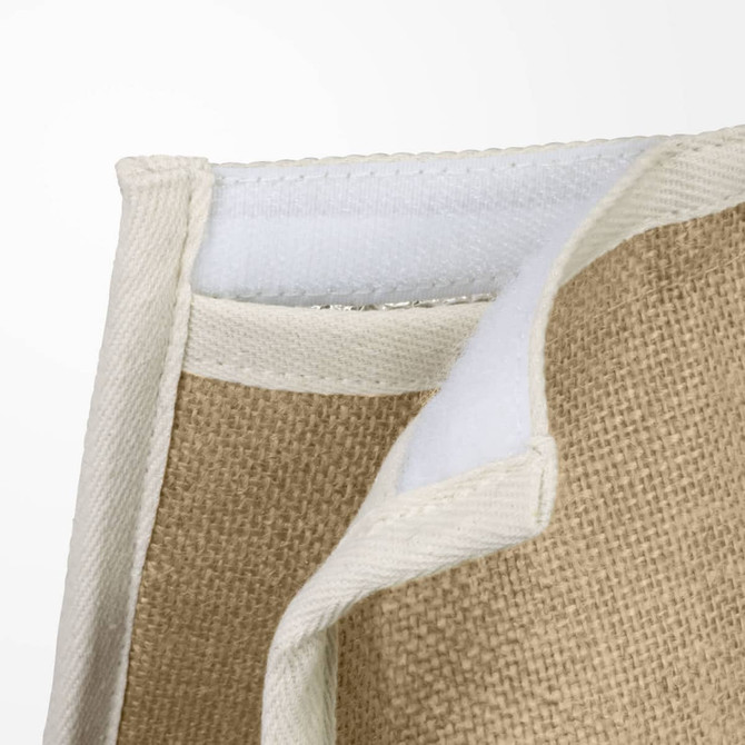 A textured jute cooler bag with a cream lining and stitching, featuring a pocket and insulating material.