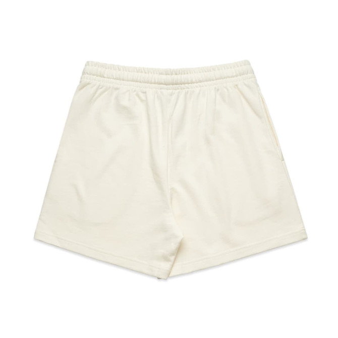 Cream-coloured sports shorts with an elastic waistband and a single side pocket, featuring a logo.