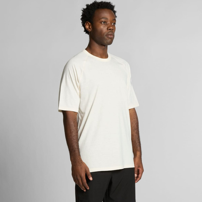 A plain cream-coloured T-shirt with short sleeves, featuring a logo on one side.