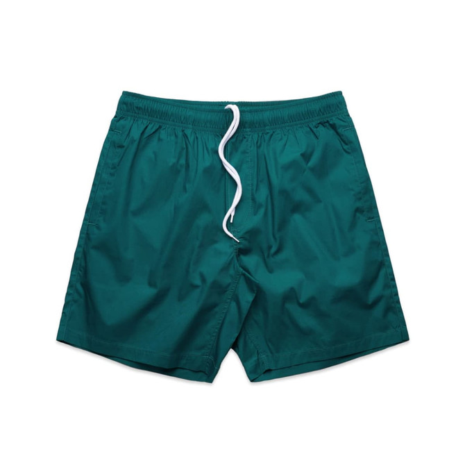 Teal beach shorts featuring an elastic waistband and drawstring detail. Includes a logo on the waistband.