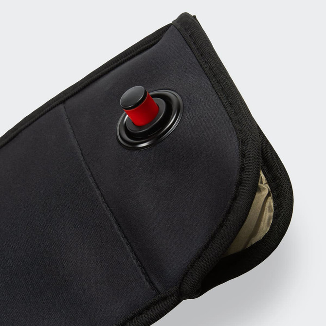 A lockable phone pouch in black with a red button and a textured interior. Features a zippered closure.